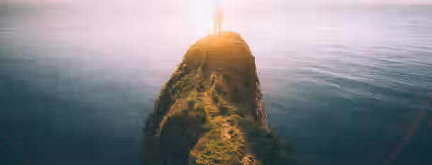 Climbing Peaks of Leadership and Growth A solitary figure stands atop a sunlit peak overlooking the vast ocean, symbolizing an emerging leader’s journey of self-improvement.