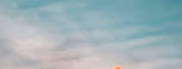 Reaching New Heights: Path to Leadership A lone climber reaches for the sky, symbolizing the ascent of an emerging leader toward self-improvement and new heights.