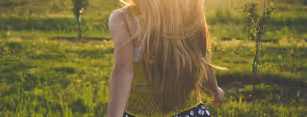 Embracing the Light: Path to Personal Growth Golden light cascades as she strides forward, embodying the path of growth and self-improvement, with nature embracing her journey.