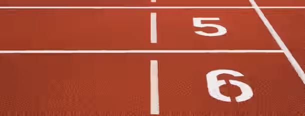Starting Line of Leadership Growth Starting blocks on a track symbolize the beginning of an emerging leader's journey towards growth and self-improvement.